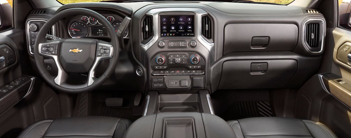 The dashboard and gray interior of a 2021 Chevy Silverado 1500 LTZ is shown.