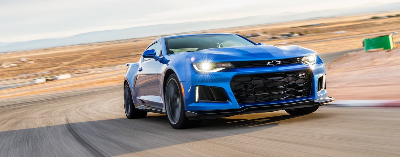One of the fastest used Chevrolets, a blue 2017 Chevy Camaro ZL1, is shown on a racetrack.