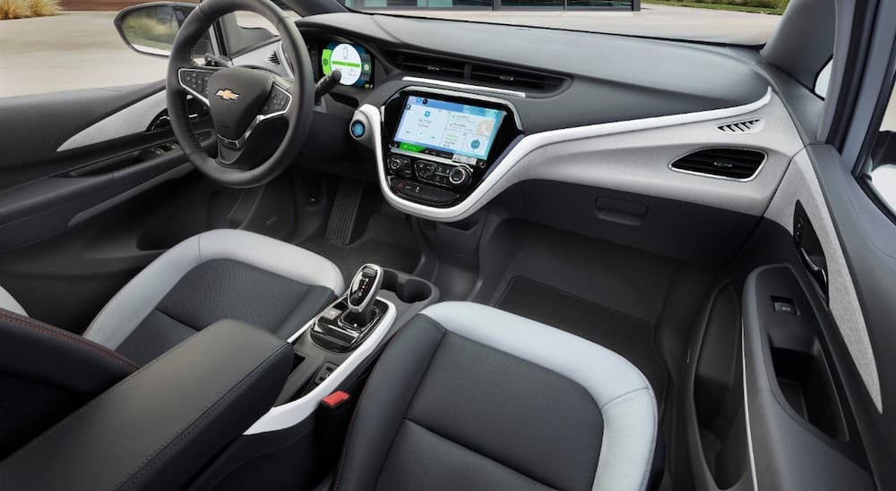 The white and black interior of a 2018 Chevy Bolt EV is shown.