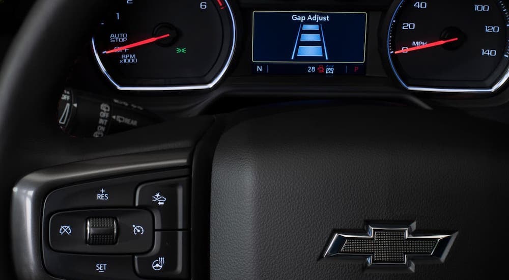 A closeup shows the gap adjustment warning on the information cluster in a 2021 Chevy Tahoe.