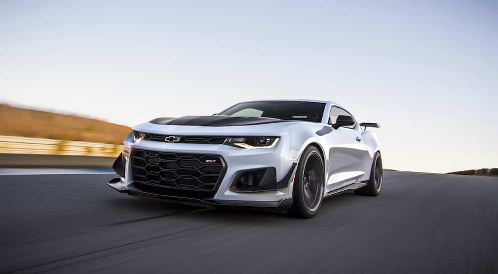 A white 2022 Chevy Camaro ZL1 1LE is shown from the front at an angle after leaving a Katy Chevy dealer.