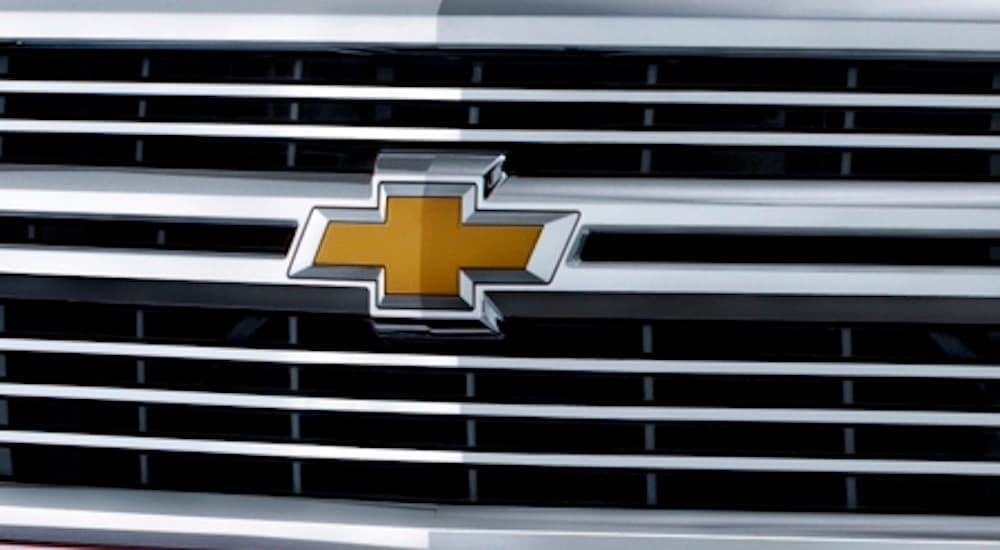 The grille of a 2015 Chevy Silverado 1500 is shown in close-up after leaving a dealer that has a used Chevy Silverado for sale near Aldine, TX.
