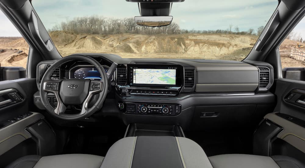 The gray interior of a 2024 Chevy Silverado 2500 HD ZR2 is shown from above the center console.