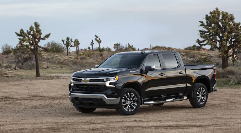 A black 2022 Chevy Silverado 1500 LTZ is shown from the side.