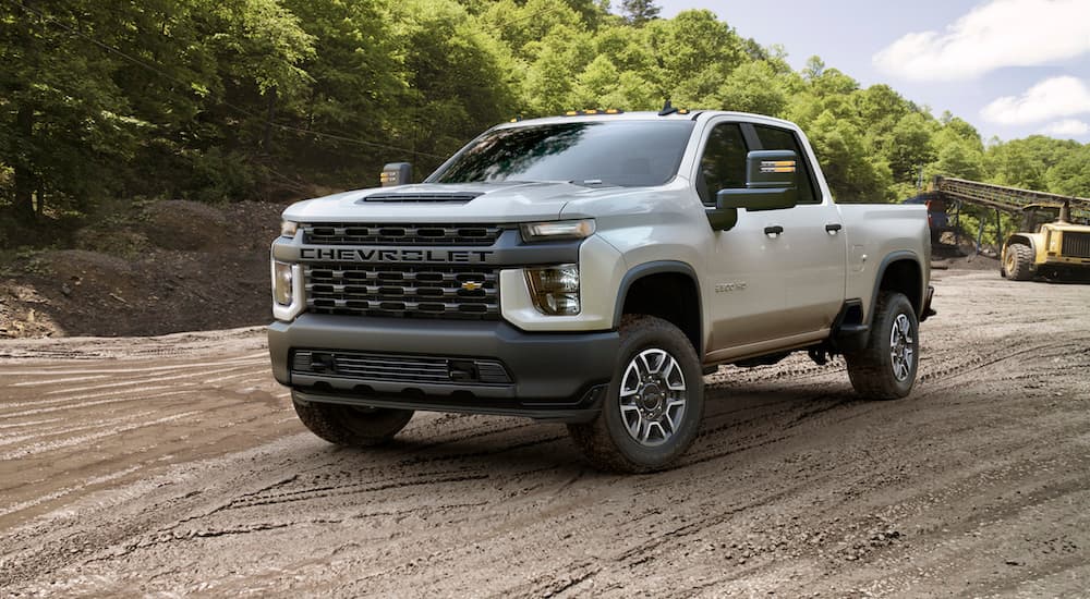 A white 2020 Chevy Silverado 2500 HD is shown from the front at an angle.