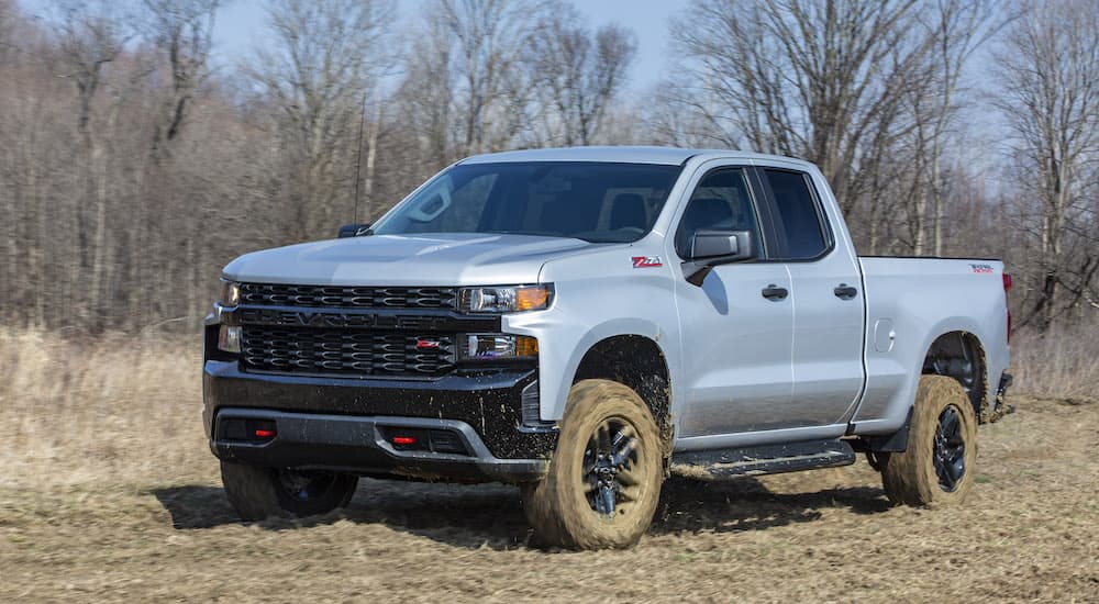 A grey 2020 Chevy Silverado Trail Boss is shown from the front at an angle.