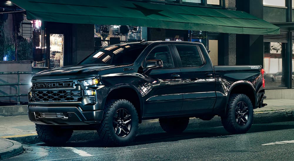 A black 2023 Chevy Silverado 1500 Z71 Trail Boss is shown from the front at an angle.