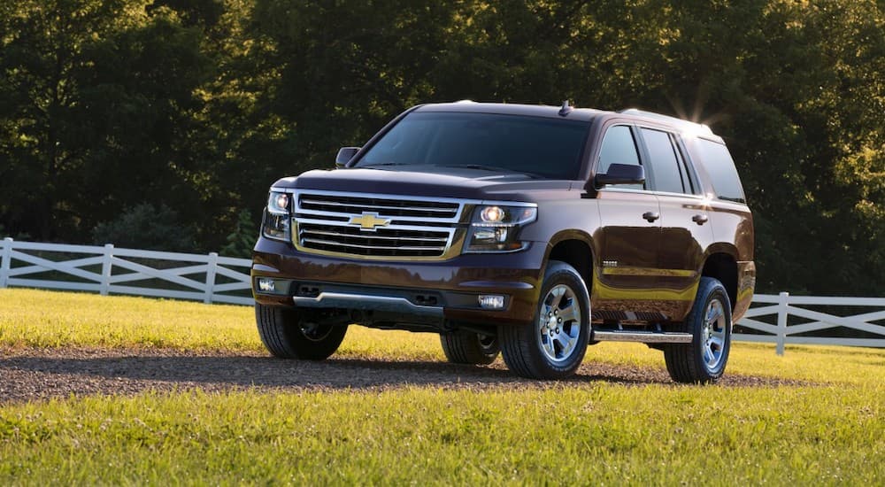 A brown 2016 Chevy Tahoe Z71 is shown parked on grass.