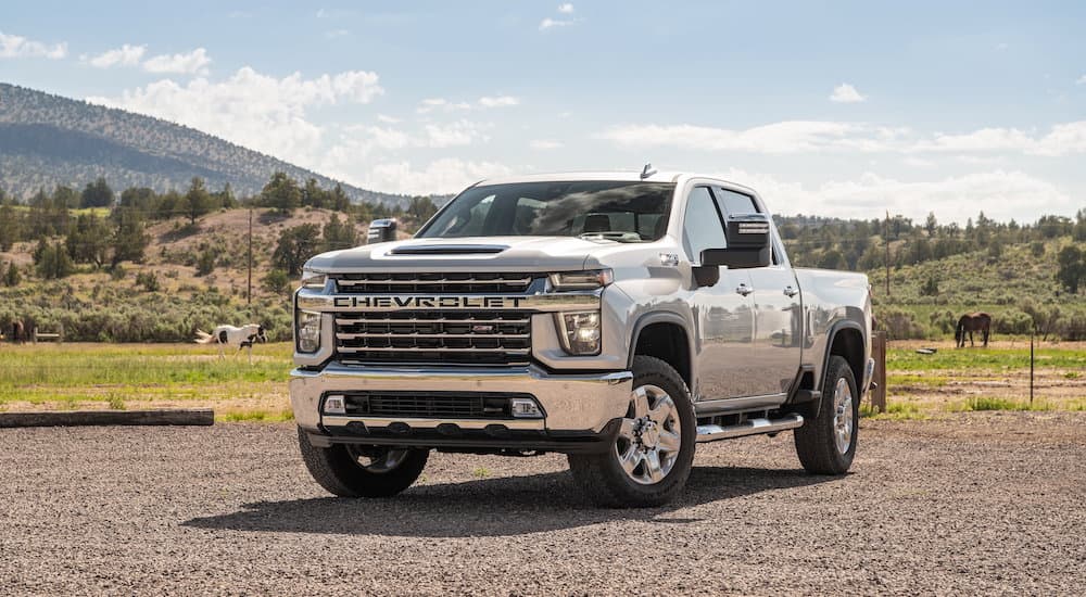 A silver 2022 Chevy Silverado 2500 HD High Country is shown from the front at an angle.