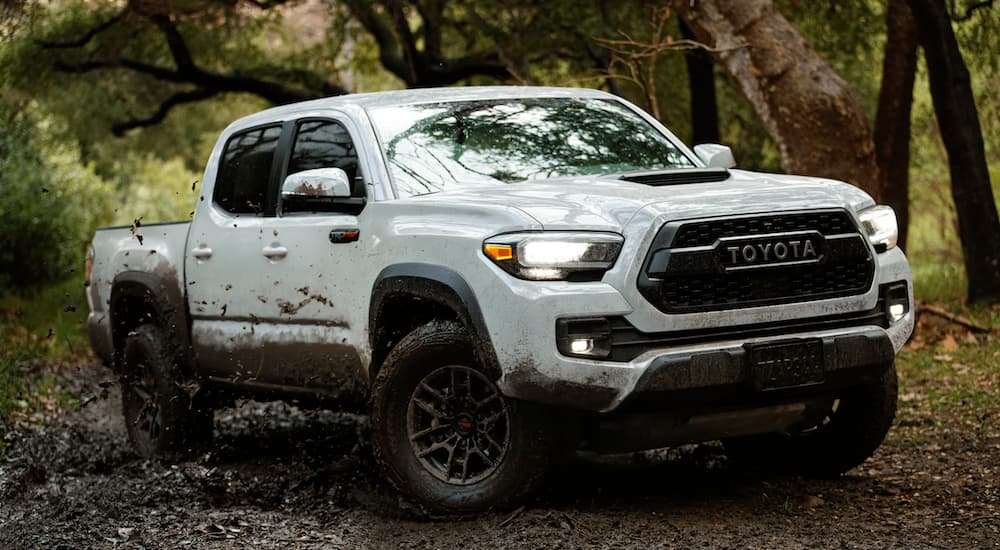 A white 2020 Toyota Tacoma TRD Pro is shown from the front at an angle after leaving a dealer that has used trucks for sale near Spring, TX.
