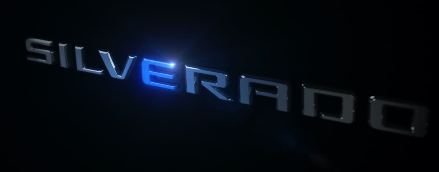 The silver Silverado logo with a blue reflection on the 'E' is shown.