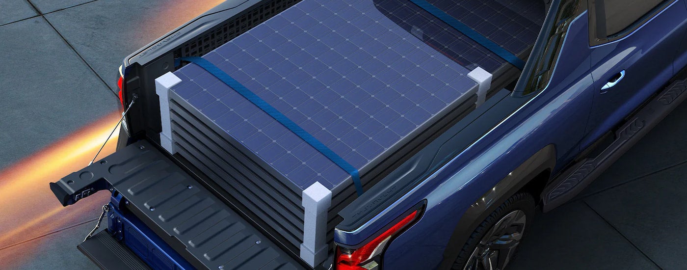 A close up of a full payload is shown in a blue 2024 Chevy Silverado EV.