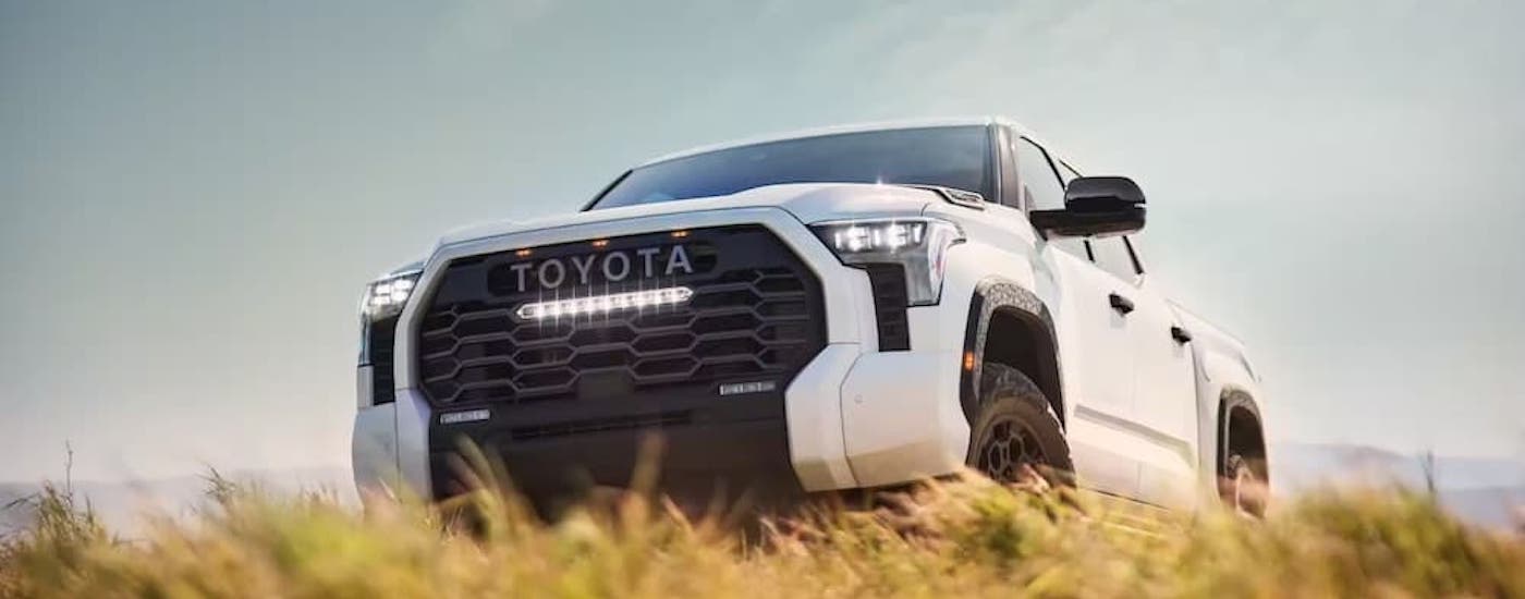 A white 2022 Toyota Tundra is shown from the front at an angle.